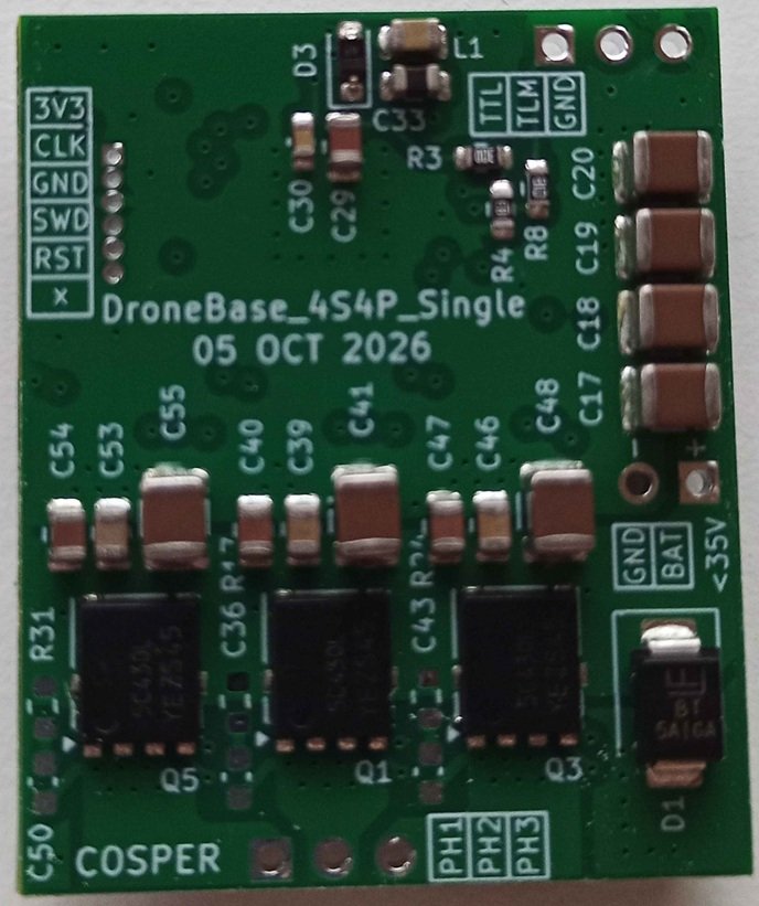 Photograph of the populated DroneBase 4S4P Single board: battery input, bulk capacitors, MOSFET stage and debug/telemetry headers